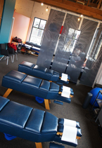 Open, airy Lyn Lake Chiropractic treatment room with a row of adjustment tables and large windows